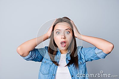 Omg! Close up portrait of amazed girl with wide open mouth and e Stock Photo