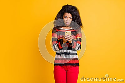 Omg its unbelievable. Portrait of negative emotional girl use her smartphone get notification about dislike in blog Stock Photo