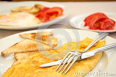 Omlette with toast bread and tomatoes Stock Photo