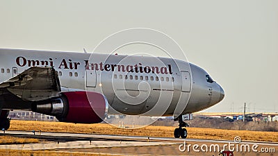 Omni Air International Boeing 767 preparing for takeoff. Editorial Stock Photo