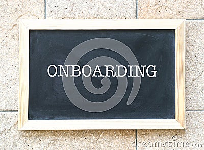 Onboarding, words printed on a blackboard Stock Photo