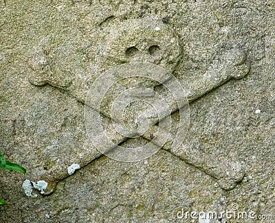 Skull and Crossbones on Gravestone Stock Photo