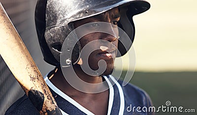 One of the best in baseball. a young man holding his bat at a baseball game. Stock Photo