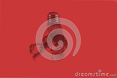 One broken light bulb on a blue background with smoke. Overdue idea concept Stock Photo