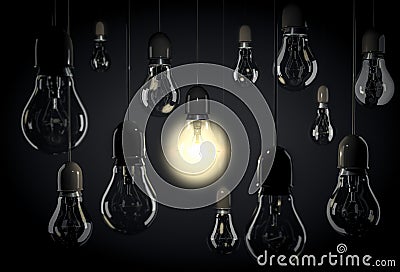 One bulb lighting up room with hanging light bulbs on wires Stock Photo