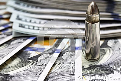 One bullet macro close up on american dollars background Stock Photo