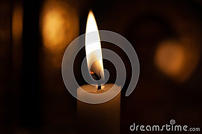 One candle flame at night closeup - isolated, macro Stock Photo