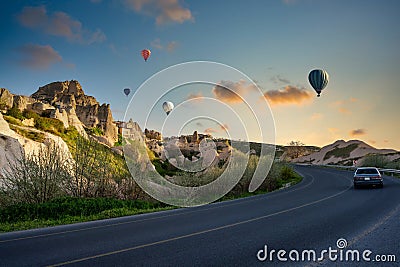 One car runs on the streets of the old town of Uchisar, a limestone mountain Stock Photo