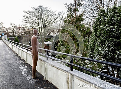 One of 23 cast iron Broken Column statues standing on a pedestrian bridge and looking over Lagard cemetery, Stavanger Editorial Stock Photo