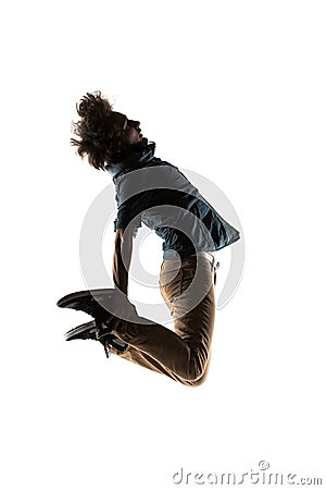 One caucasian young acrobatic break dancer breakdancing man in silhouette white background Stock Photo