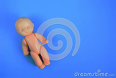 one childrens toy doll for children from one year on a blue background with a place for the inscription. close up Stock Photo