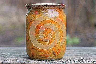 one closed glass jar with red yellow canned salad Stock Photo
