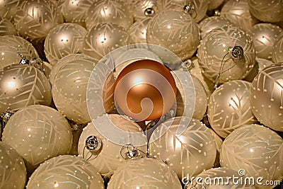 One different Christmas bauble among all white baubles Stock Photo