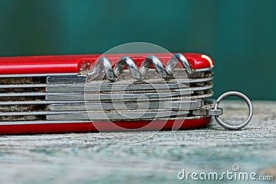 Iron dirty tool multitool lying on a gray table Stock Photo