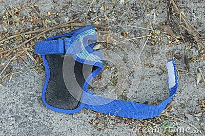 One empty pistol holster with a belt made of black leather and blue fabric Stock Photo
