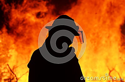 One firefighter rescue worker at wild fire bushfire blaze Stock Photo