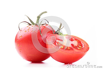 One full tomato and one half a tomato Stock Photo