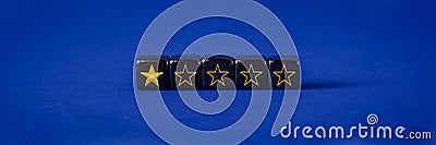 One gold star ranking on black cubes in conceptual image of online feedback Stock Photo