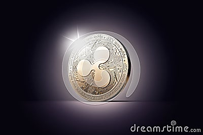 One golden Ripple coin XRP on a gently lit dark background. Editorial Stock Photo