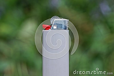 One gray lighter made of metal and plastic Stock Photo