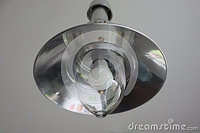 One gray metal chandelier with a white light Stock Photo