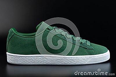 One green casual shoe with laces Stock Photo