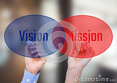 One hand writingVISION in blue circle with opacity and other hand writing MISSION in red circle with Stock Photo