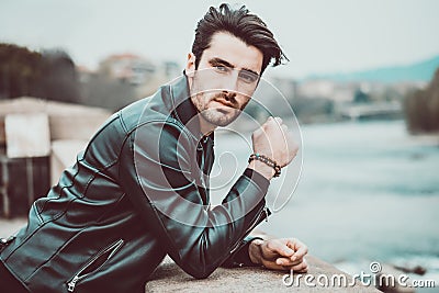 One handsome young man in modern city setting Stock Photo