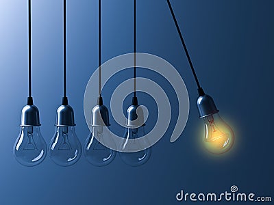 One hanging light bulb glowing different and stand out from unlit incandescent bulbs like newtons cradle on dark blue background Stock Photo