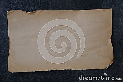 one horizontal textural sheet of paper, stack of sheets old retro paper without writing on black background, empty mock up Stock Photo
