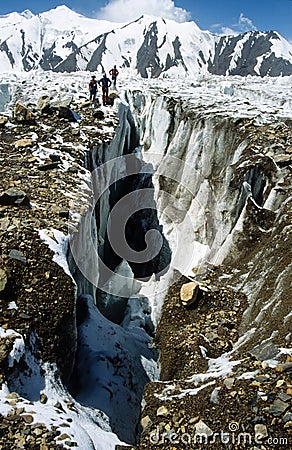 One of the huge glacier crevasses of the Fedtschenko Glacier in the Pamir mountains Stock Photo