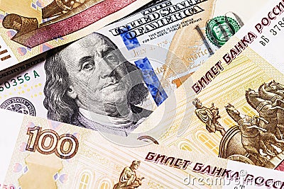 One hundred dollars surrounded by Russian rubles Stock Photo