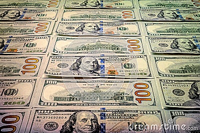 One hundred US dollars texture. A lot of banknotes. A pile of bills of American dollars. Money background Stock Photo