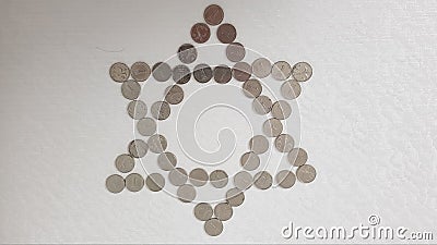 One israeli shekel metal coins arranged on white background in a shape of jewish six points star Stock Photo