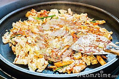 One of Korean favorite : Korean spicy stir fried vegetable, chicken and Korean spicy sauce (Gochujang) in big hot pan Stock Photo