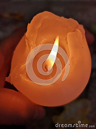 One large decorative candle burns Stock Photo