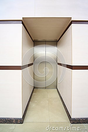 One lift with closed metallic doors Stock Photo