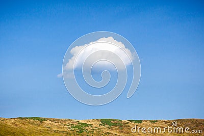 One lonely cloud in blue sky. Stock Photo