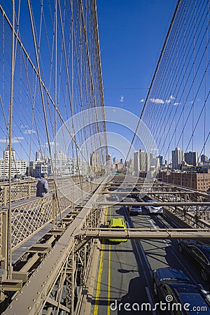 One of the main attractions in New York - famous Brooklyn Bridge- MANHATTAN - NEW YORK - APRIL 1, 2017 Editorial Stock Photo
