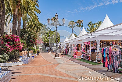 One of the main pretty squares in Ayamonte, Spain during the summer when there are stores selling clothes, sweets and souvenirs Stock Photo