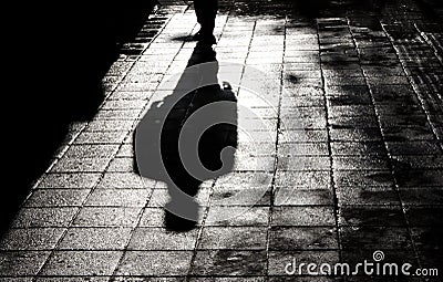 One man alone in the dark shadow silhouette Stock Photo