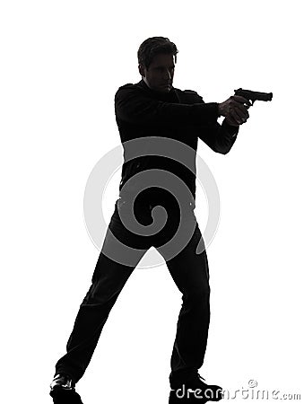 Man killer policeman aiming gun standing silhouette Stock Photo