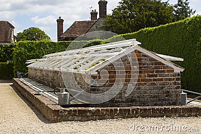 One of many brick built cold frames in the famous walled garden in West dean estate in West Sussex in the South of England Editorial Stock Photo