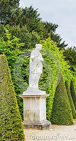 One of many sculptures in the antique style, located in the gar Editorial Stock Photo