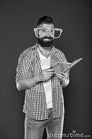 One more chapter. University male student reading lecture notes. Study nerd holding book. Book nerd wearing fancy Stock Photo