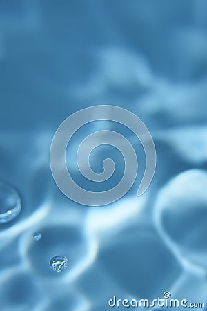 008.One or more drops of water splashing into waves and undefined shapes. Wallpaper Stock Photo