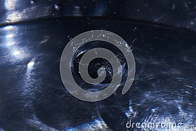 169.One or more drops of water splashing into waves and undefined shapes. Wallpaper Stock Photo