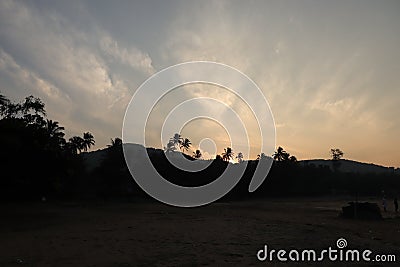 Sunrise hues in sky at Gokarna Beach - Konkan Indian beach - Arabian sea - beach holiday Stock Photo