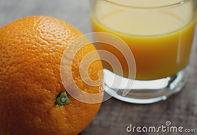 One navel orange fruit with a glass of fresh orange juice Stock Photo