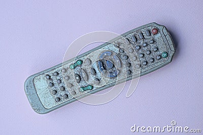 One old gray dirty plastic television remote control Stock Photo